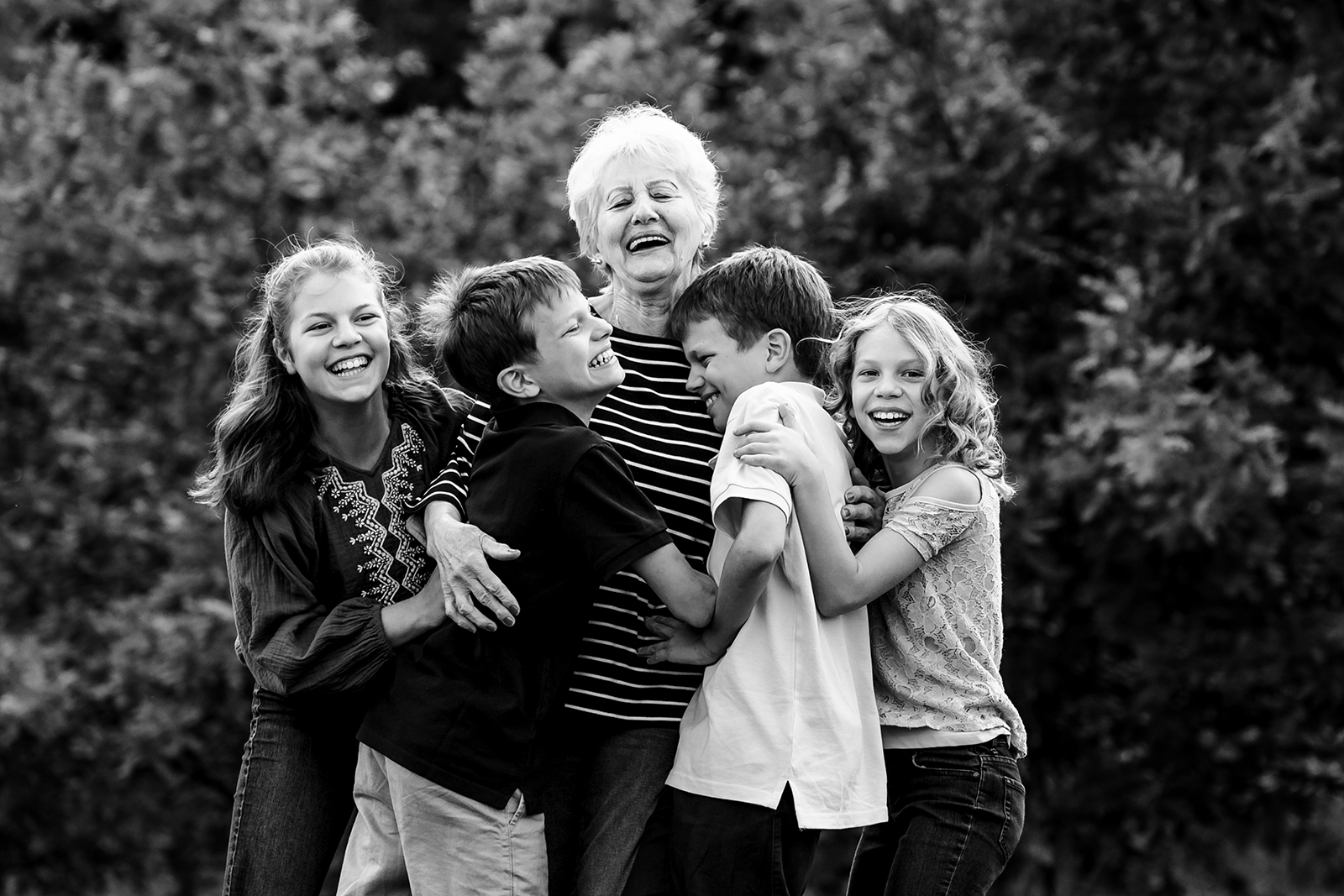 Grandma portrait with grandchildren by Piccolino Photo Studio in Beckenham